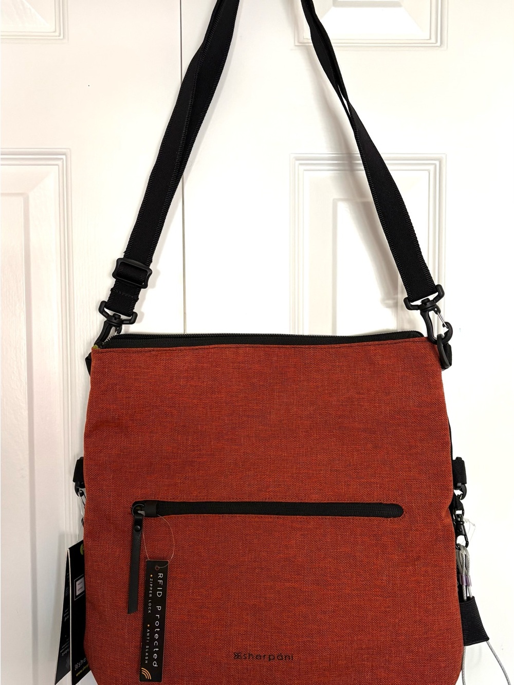 Sherpani Rust Orange Crossbody Bag with Black Strap